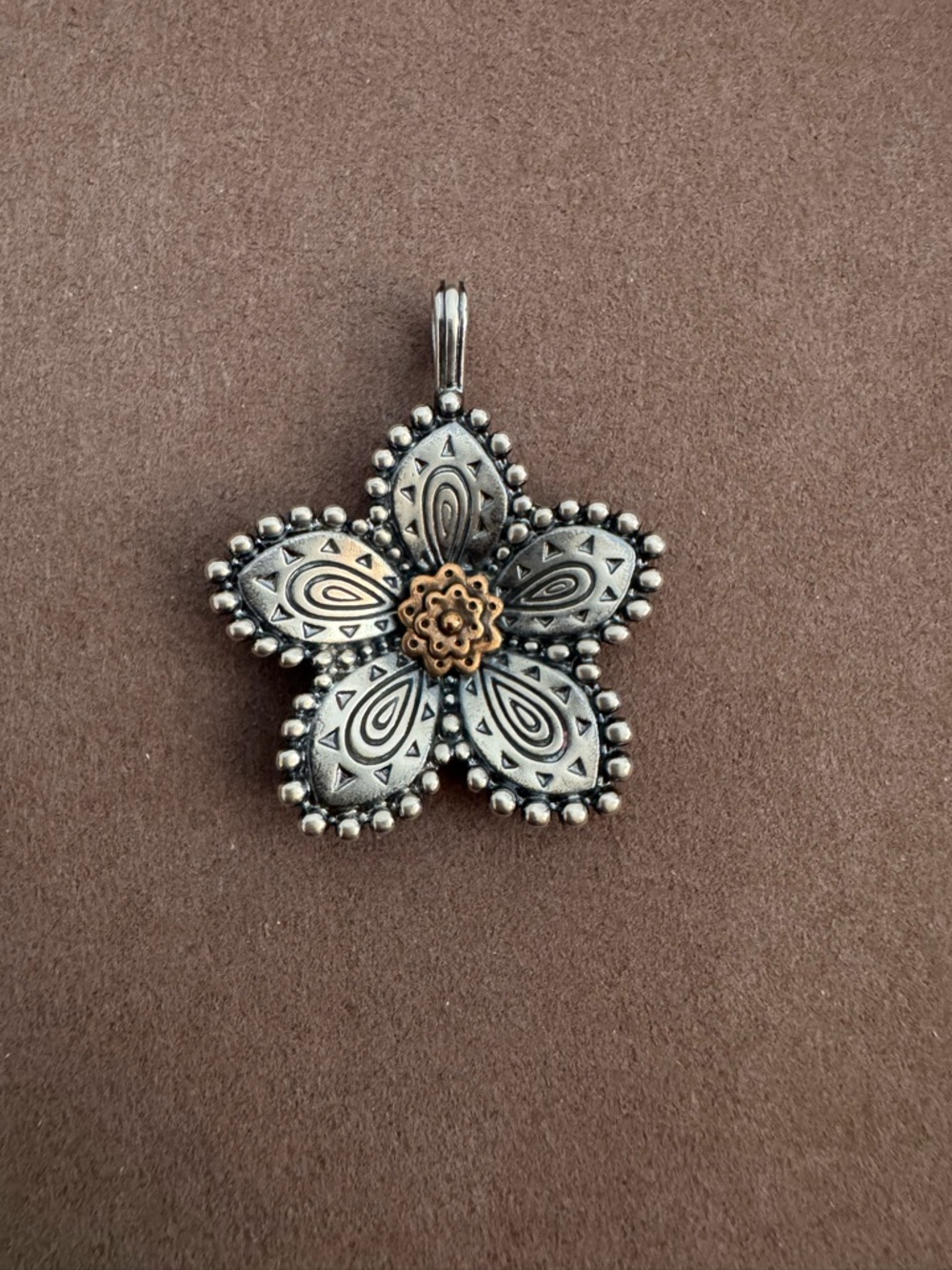 Retired James Avery festive flower pendant